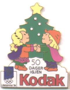 Kodak with number mascots Kristin and Håkon with a christmas tre